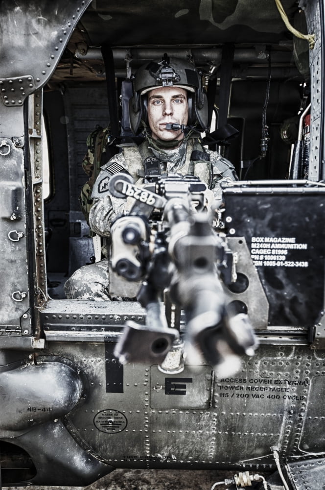 HDR image of a UH-60 Black Hawk door gunner manning a M240 machine gun Canvas Art - Terry MooreStocktrek Images (23 x 35)