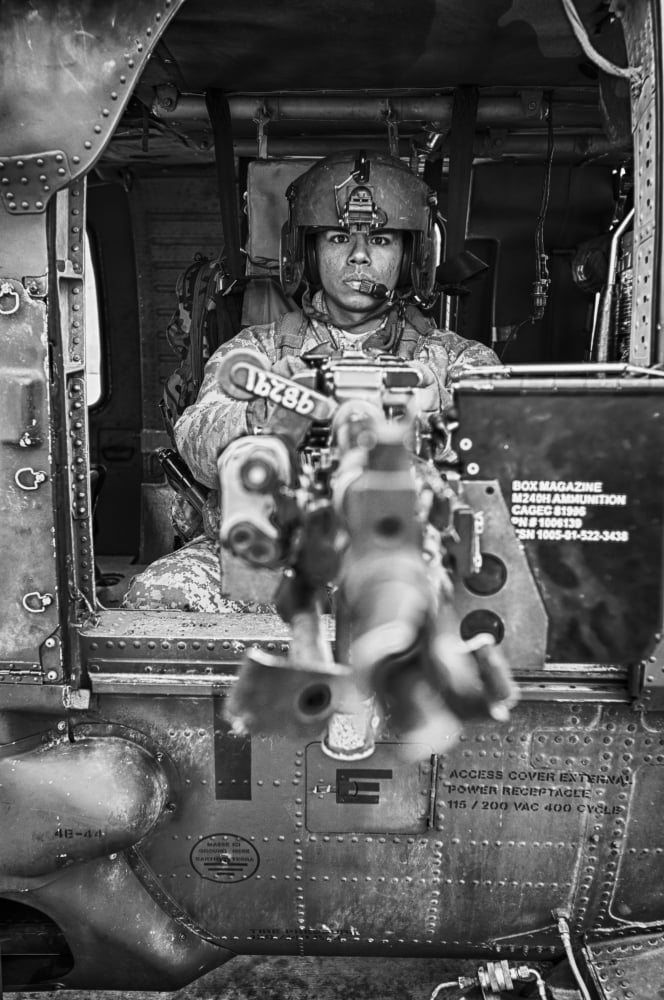 HDR image of a UH-60 Black Hawk door gunner manning a M240 machine gun Canvas Art - Terry MooreStocktrek Images (23 x 35)