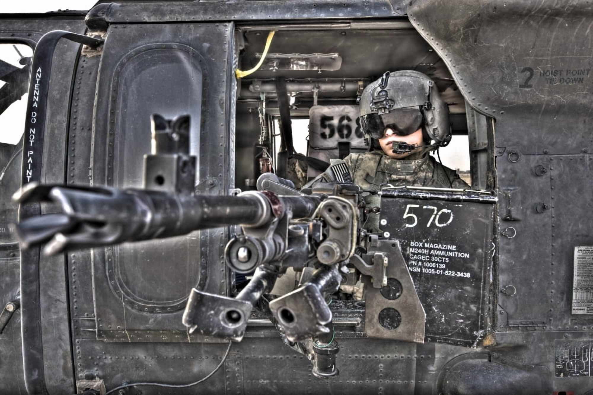 HDR image of a UH-60 Black Hawk door gunner manning a M240 machine gun Canvas Art - Terry MooreStocktrek Images (35 x 23)