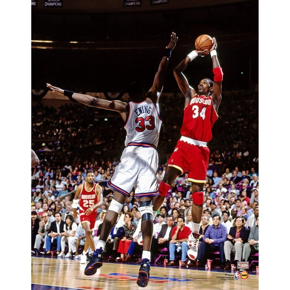 Hakeem Olajuwon Houston Rockets Unsigned Red Jersey Shooting Photograph
