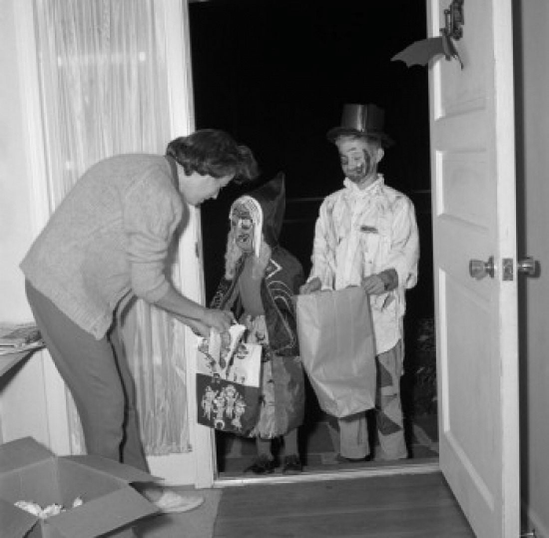Halloween kids in costumes doing trick or treat Canvas Art - (24 x 36)