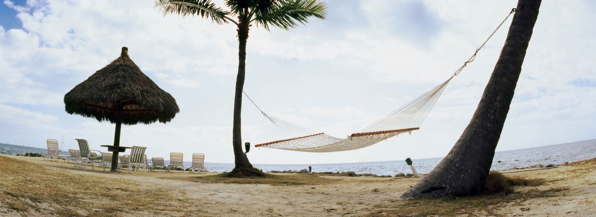 Hammock and umbrella on the beach Key Largo Florida Keys Florida USA Canvas Art - Panoramic Images (13 x 36)