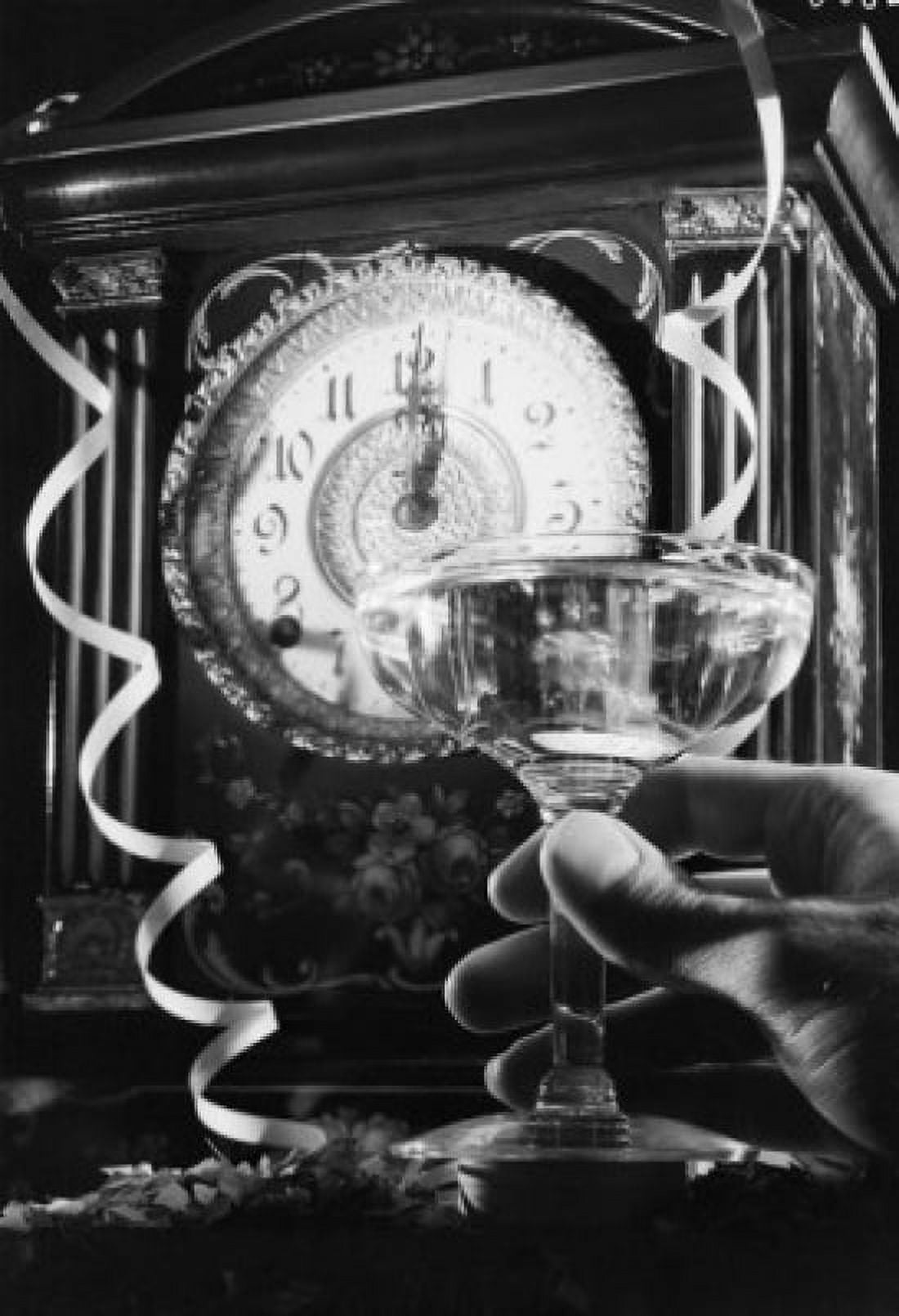 Hand holding champagne flute with champagne clock showing 12 oclock in the background Canvas Art - (24 x 36)