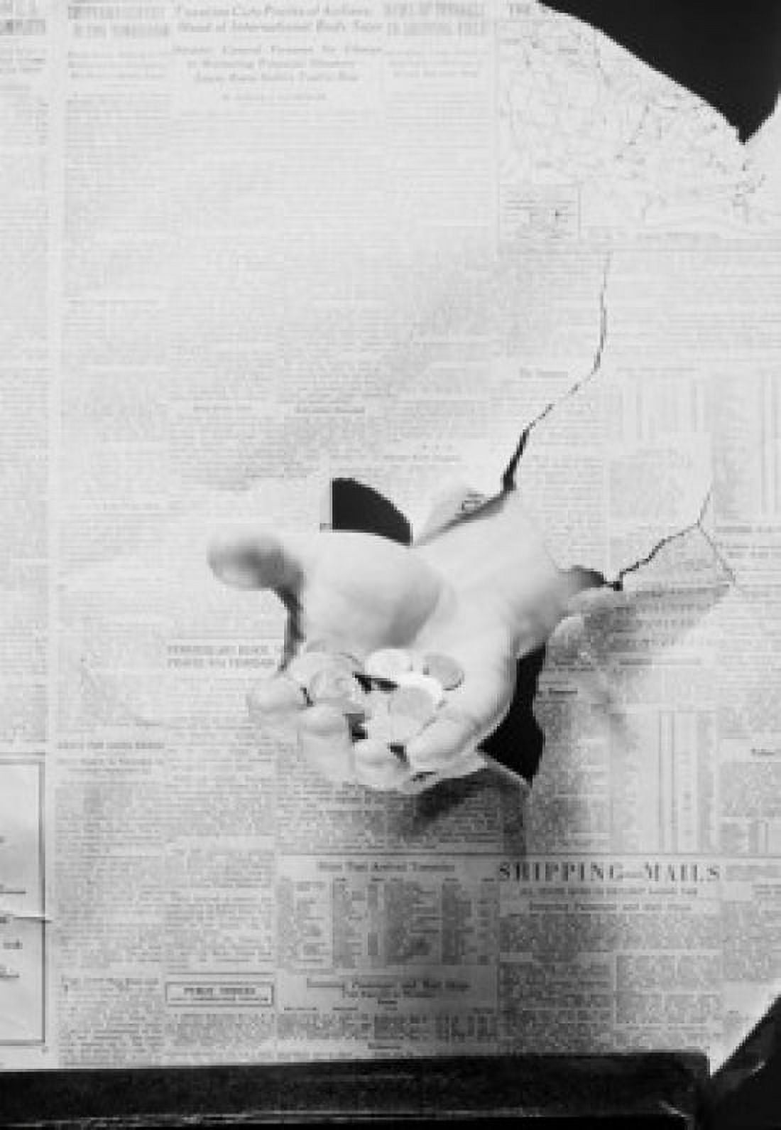 Hand holding coins though financial newspaper Canvas Art - (18 x 24)