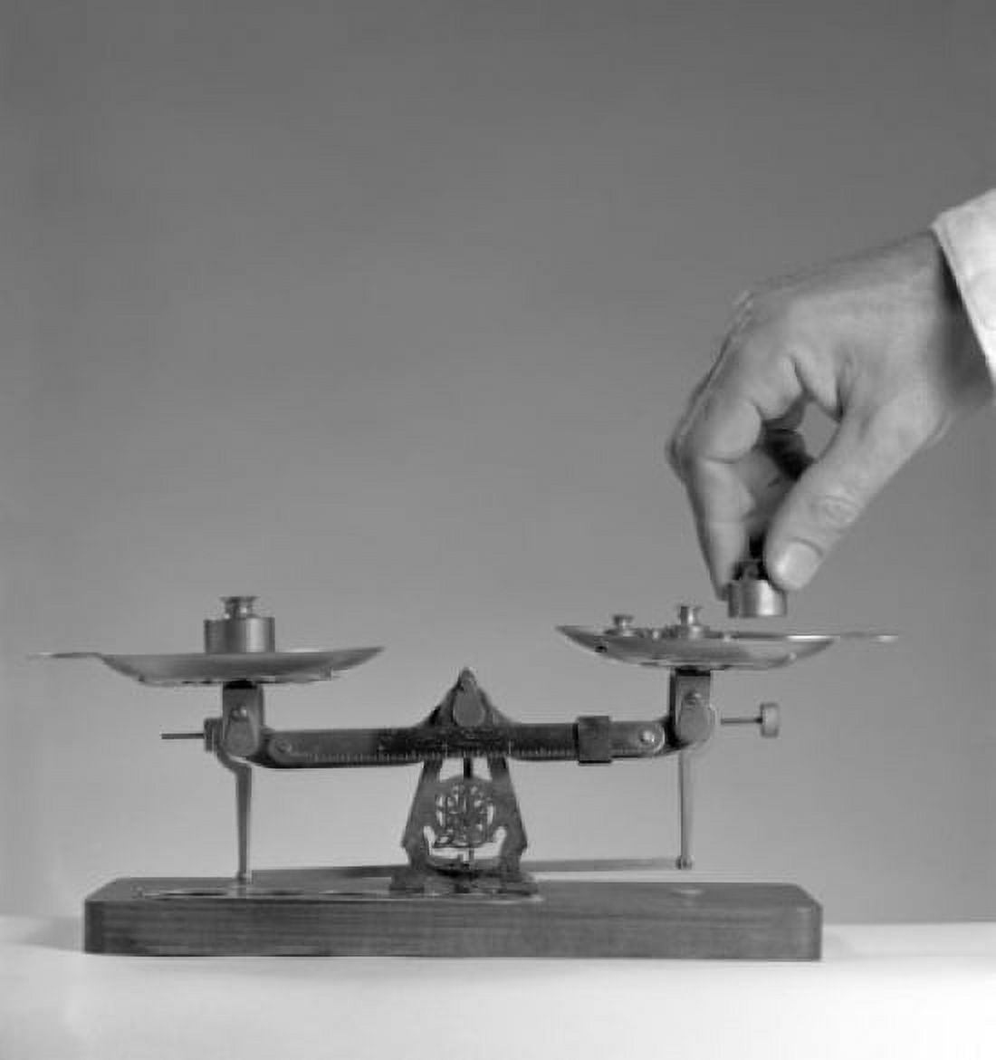 Hand putting weight onto scale Canvas Art - (24 x 36)