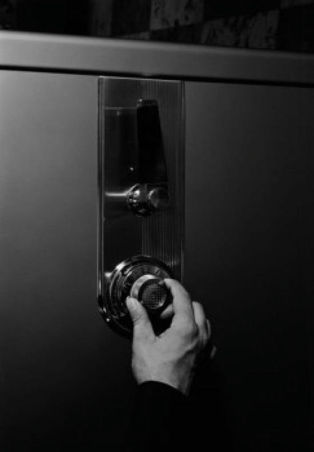 Hand unlocking safe Canvas Art - (24 x 36)