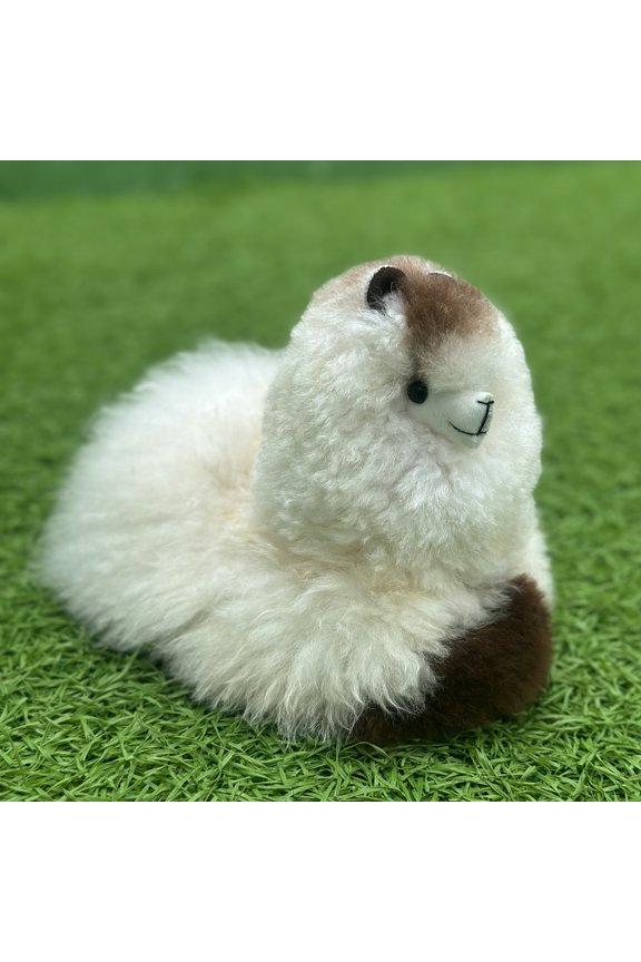 Handmade plush alpaca doll in a lying position; cute and fun gift.