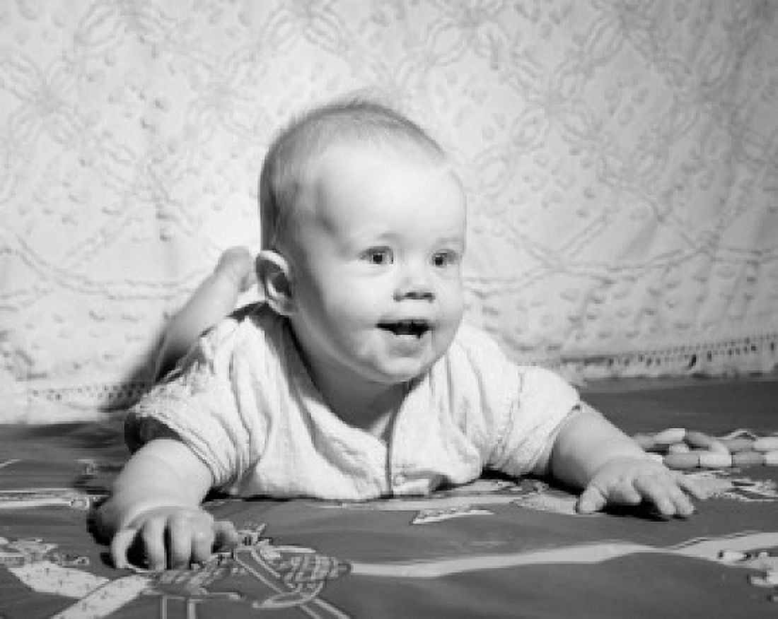 Happy baby lying on front Canvas Art - (24 x 36)