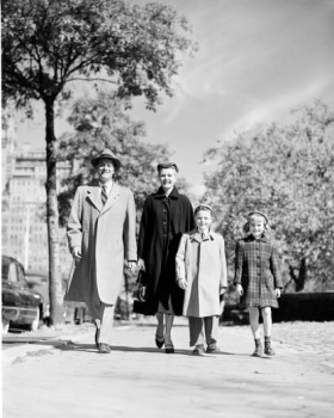 Happy family with two children walking front view Canvas Art - (24 x 36)
