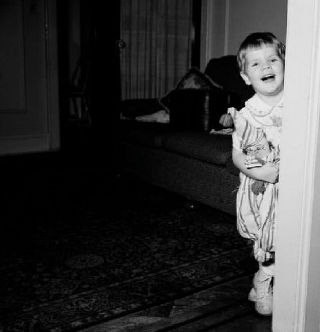 Happy girl holding toy and laughing Canvas Art - (24 x 36)