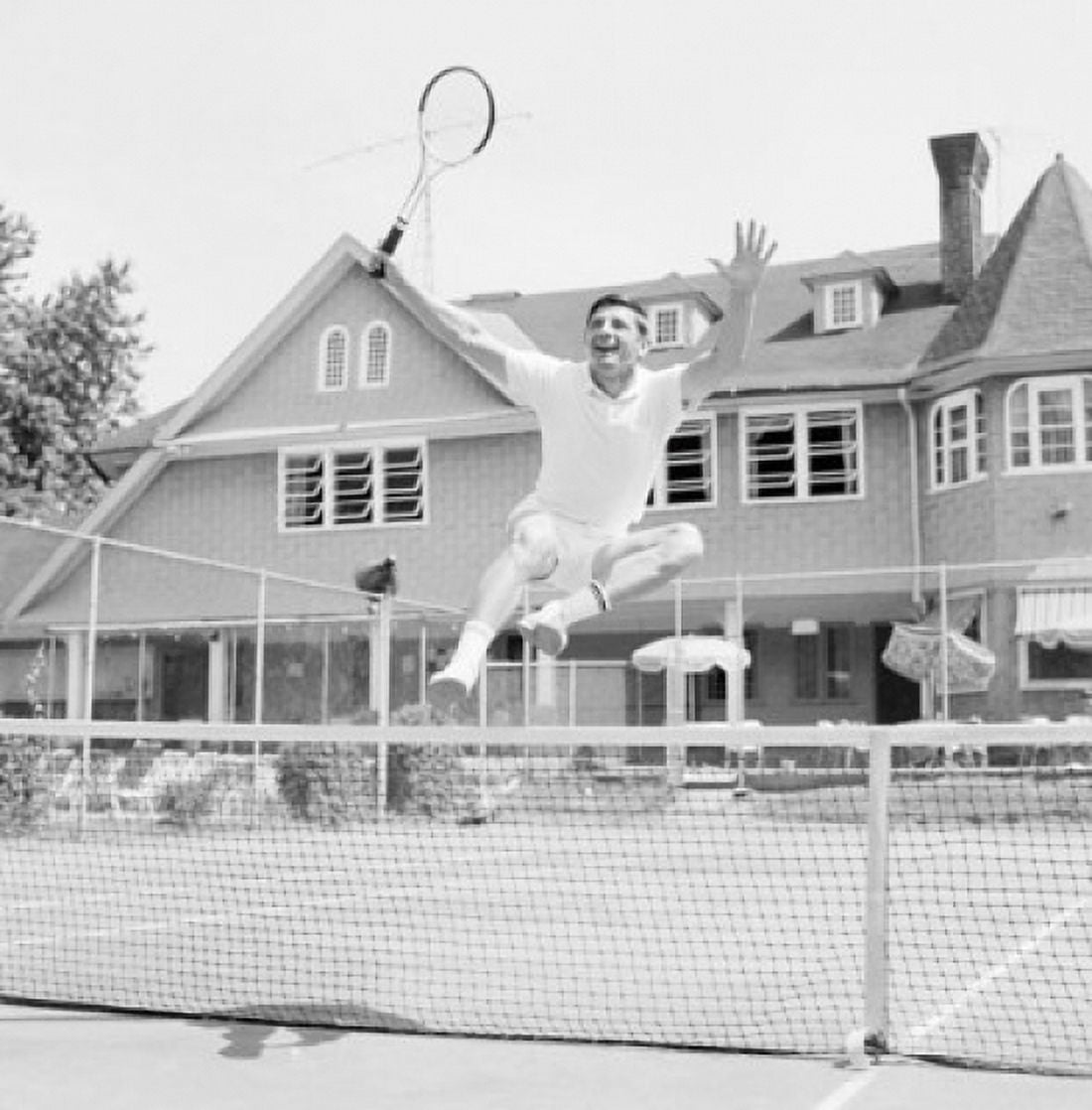 Happy man jumping when playing tennis Canvas Art - (18 x 24)