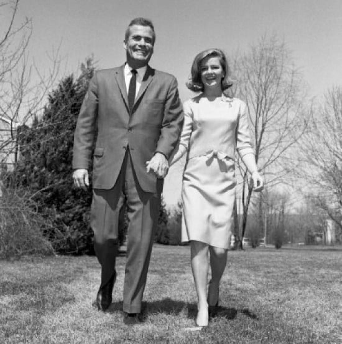 Happy mature couple holding hands and walking through park low angle view Canvas Art - (18 x 24)