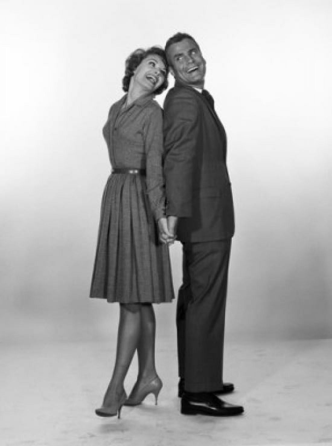 Happy mid adult couple holding hands studio shot Canvas Art - (18 x 24)