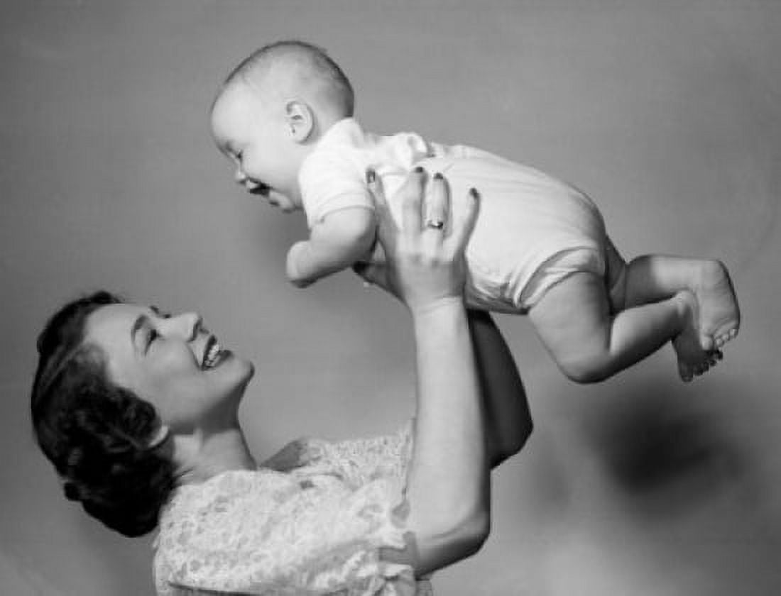 Happy mother lifting up baby Canvas Art - (24 x 36)