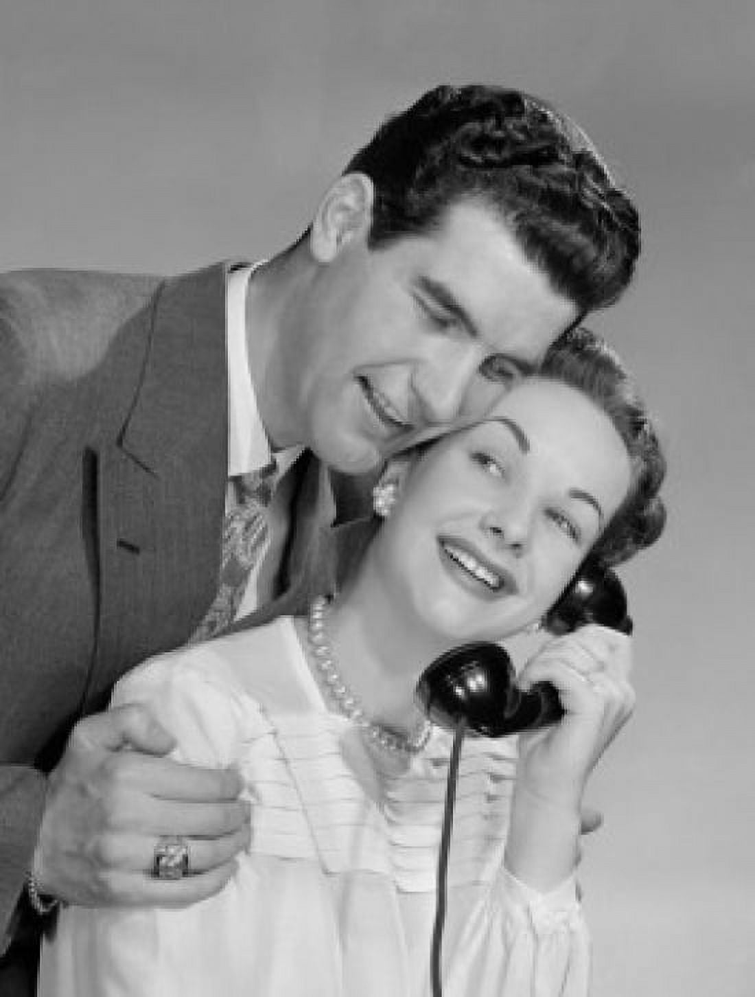 Happy young couple using telephone Canvas Art - (24 x 36)