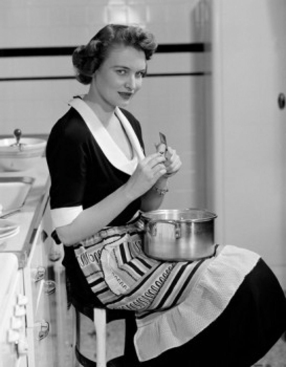 Happy young woman peeling carrot and looking at camera Canvas Art - (24 x 36)
