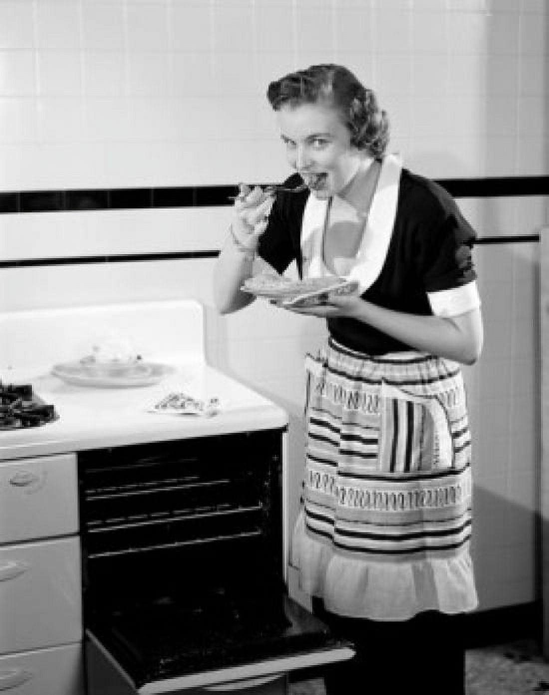 Happy young woman trying freshly baked pie Canvas Art - (24 x 36)