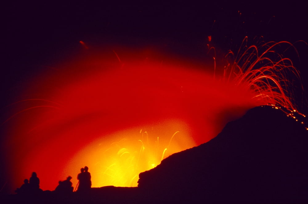 Hawaii Big Island Hawaii Volcanoes National Park Lava Exploding Silhouettes Of Few People Canvas Art - Greg Vaughn  Design Pics (19 x 12)