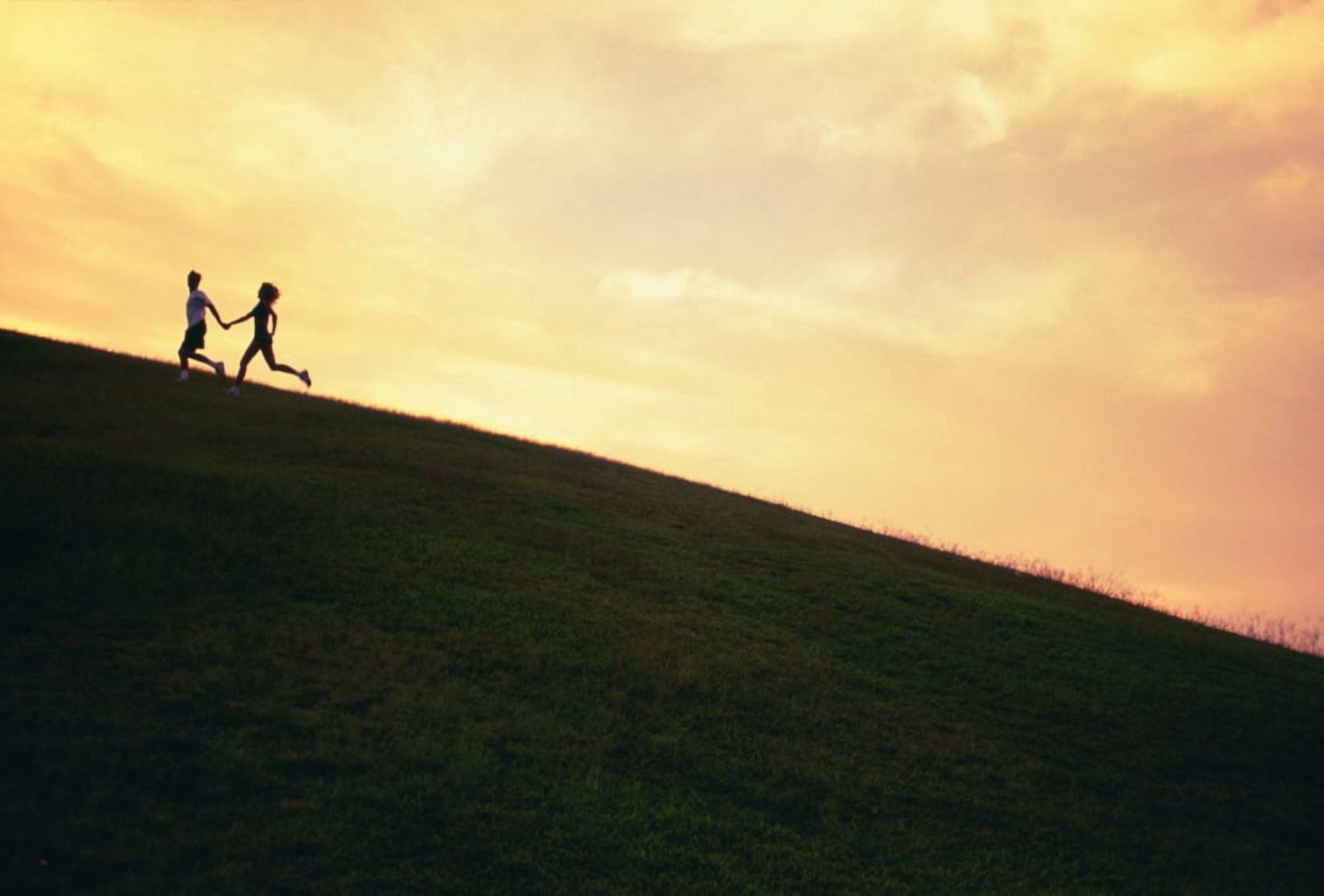 Hawaii Couple Running Along A Hill At Sunset Canvas Art - Dana Edmunds Design Pics (19 x 12)
