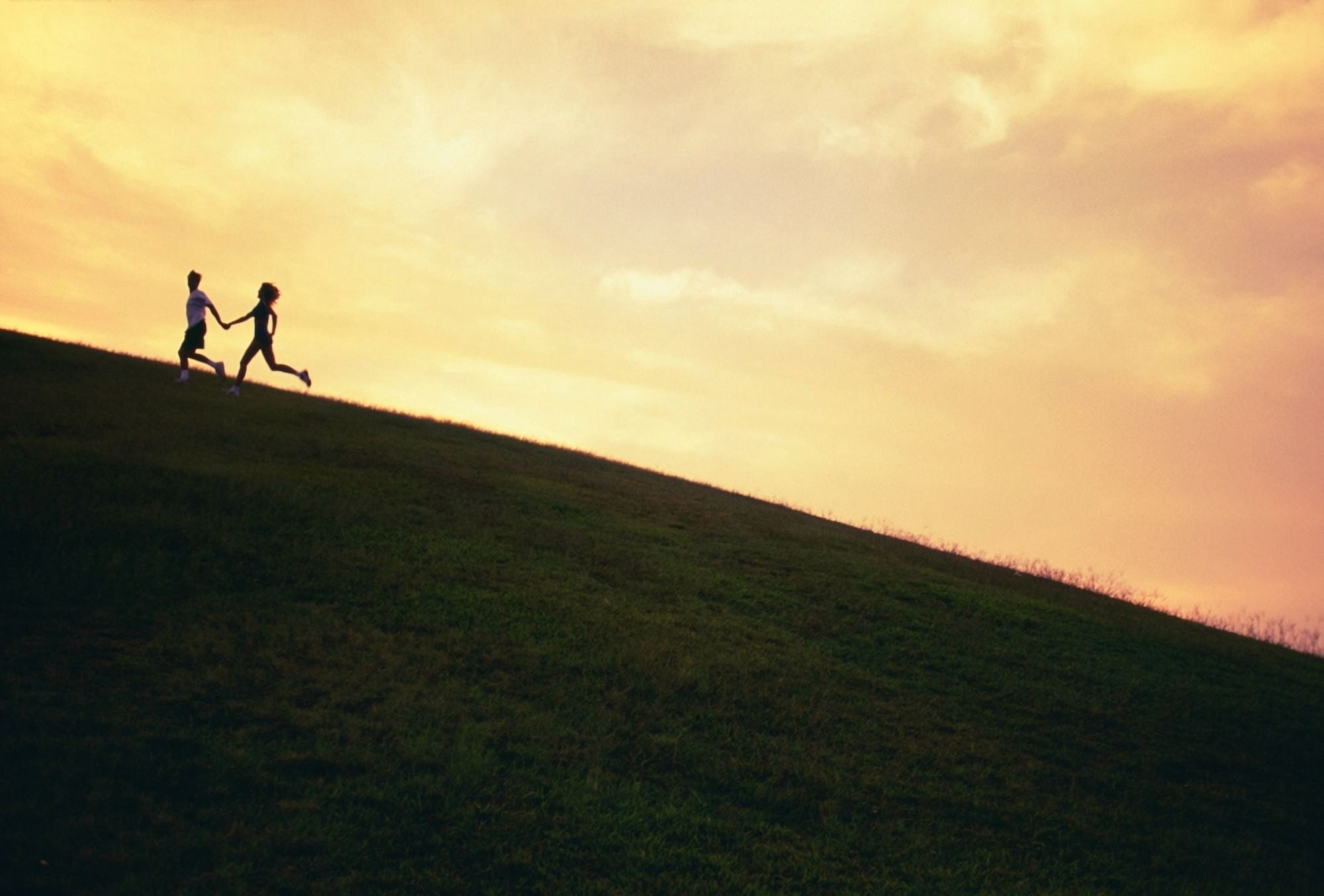 Hawaii Couple Running Along A Hill At Sunset Canvas Art - Dana Edmunds Design Pics (38 x 24)