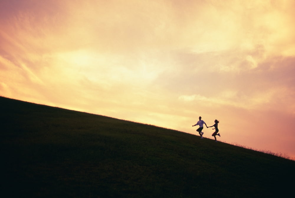 Hawaii Couple Running Along A Hill At Sunset Canvas Art - Dana Edmunds Design Pics (38 x 24)