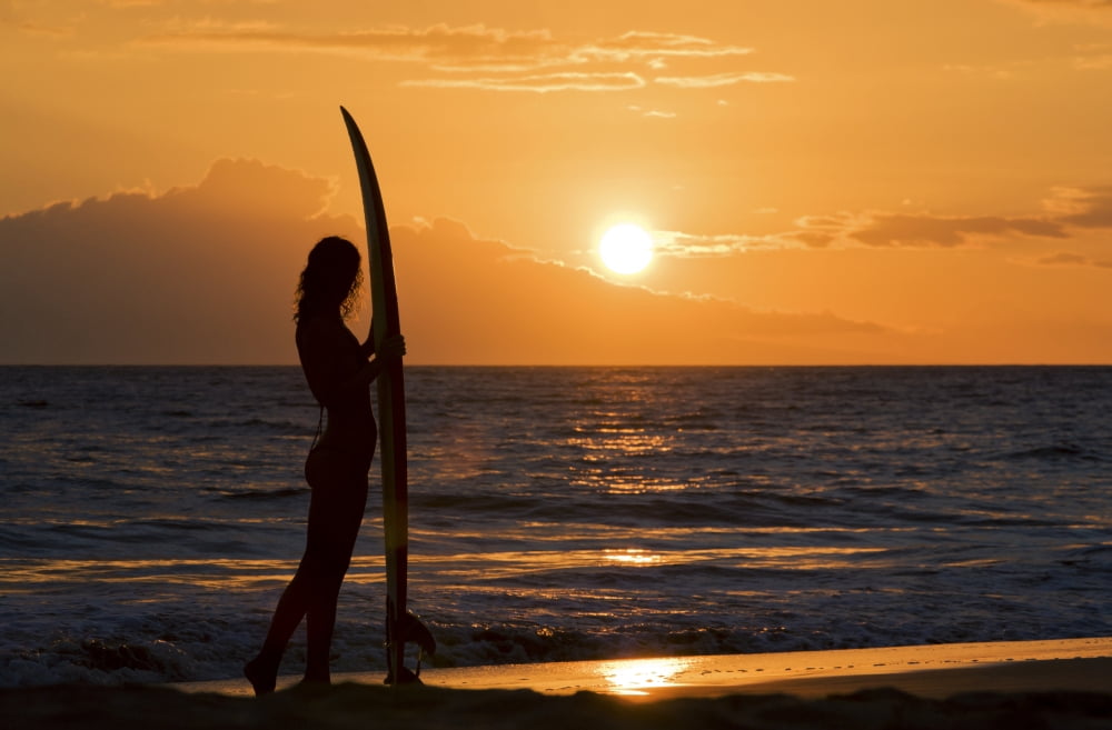 Hawaii Female Surfer On Beach Silhouetted Against Orange Sunset Over Ocean Canvas Art - M Swiet Productions Design Pics (36 x 22)