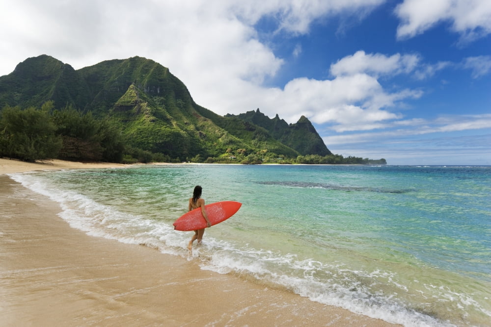 Hawaii Kauai Haena Beach Tunnels Beach Woman Entering Ocean With Surfboard Canvas Art - M Swiet Productions Design Pics (18 x 12)