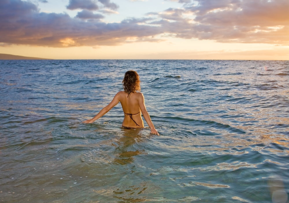 Hawaii Kauai Woman Walking In The Ocean As The Sun Sets Canvas Art - M Swiet Productions Design Pics (36 x 26)