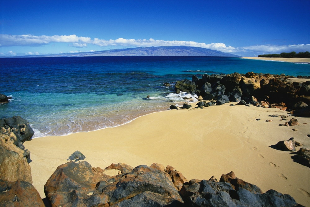 Hawaii Lanai Polihua Beach Footprints In Sand Rocks Around Beach Molokai In Distance Canvas Art - Ron Dahlquist  Design Pics (19 x 12)