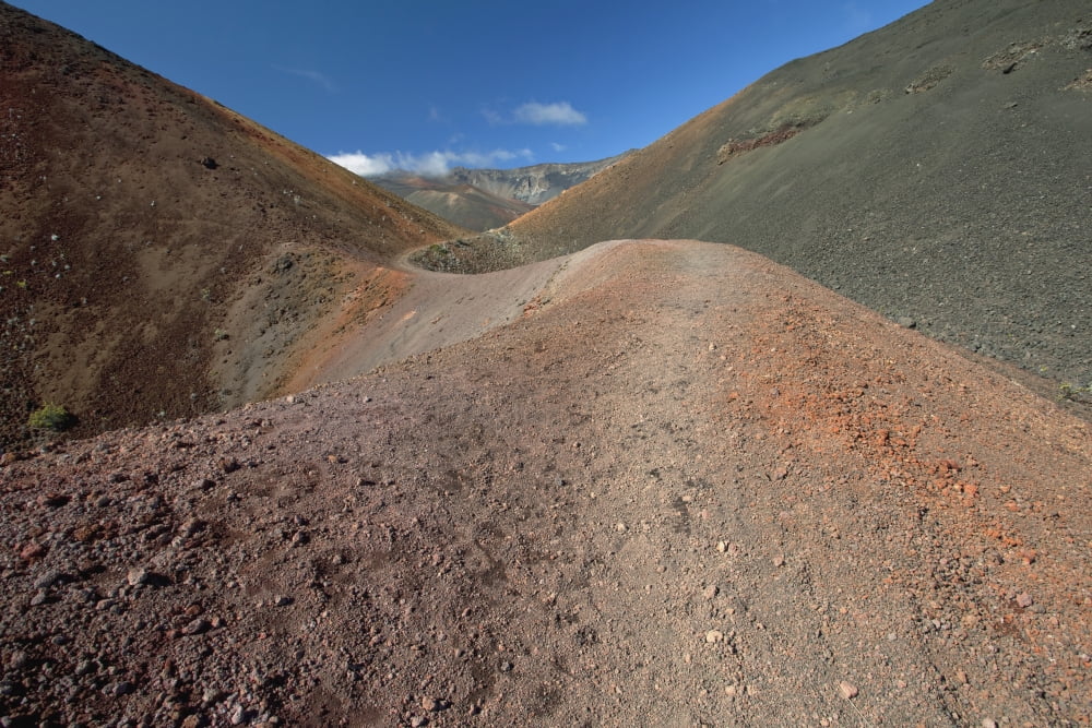 Hawaii Maui Haleakala The long trail through colorful lava rock and blue sky Canvas Art - Jenna Szerlag Design Pics (19 x 12)