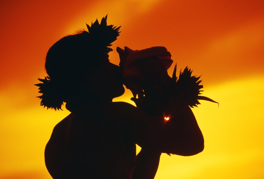 Hawaii Maui Napili Silhouette Of Man Blowing Conch Shell At Sunset Fiery Orange Sky Canvas Art - Ron Dahlquist Design Pics (18 x 12)
