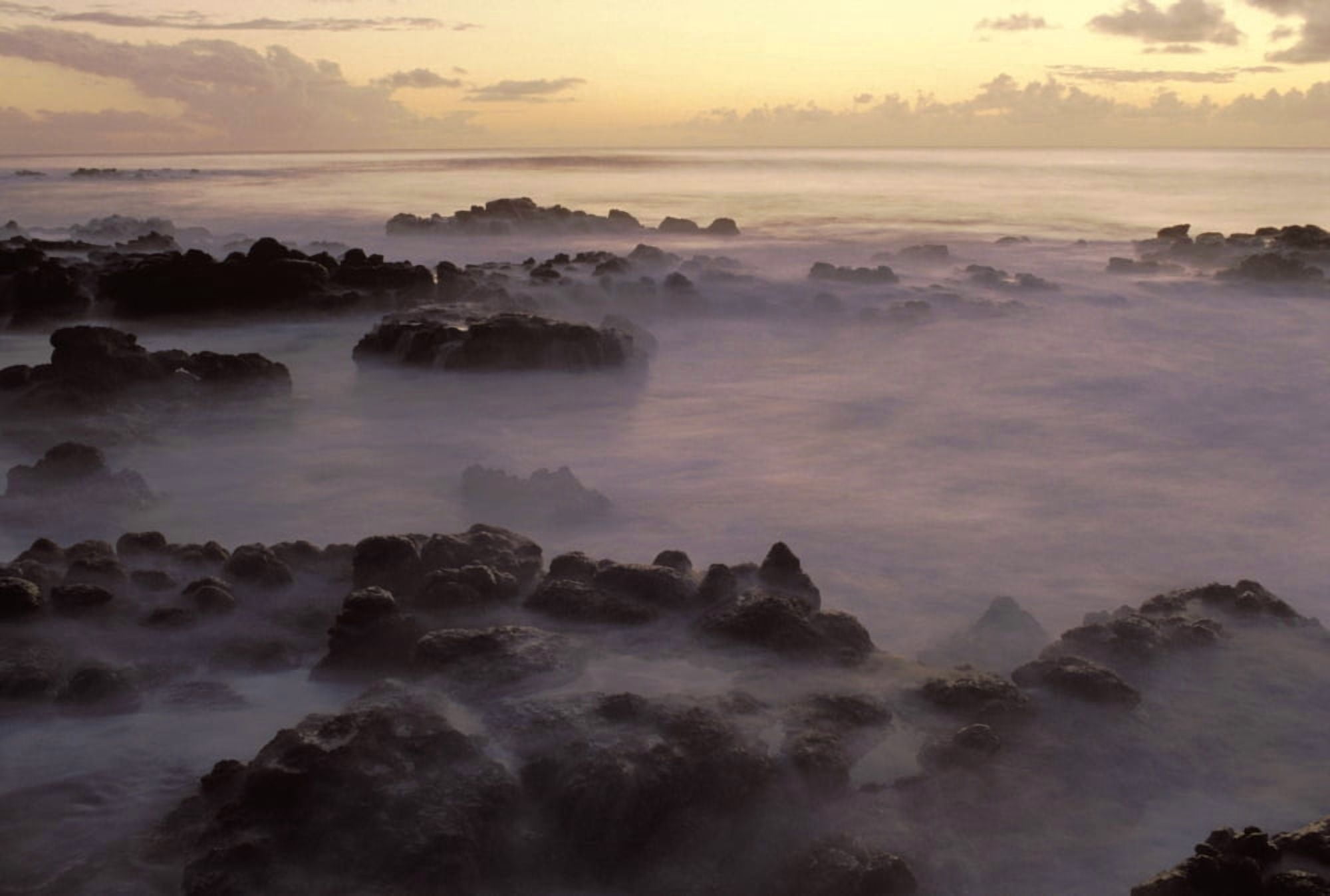 Hawaii Molokai Kau Poa Beach Lava Rocks In Foggy Layer Over Pale Sunrise Water Canvas Art - Robert Sablan  Design Pics (34 x 22)