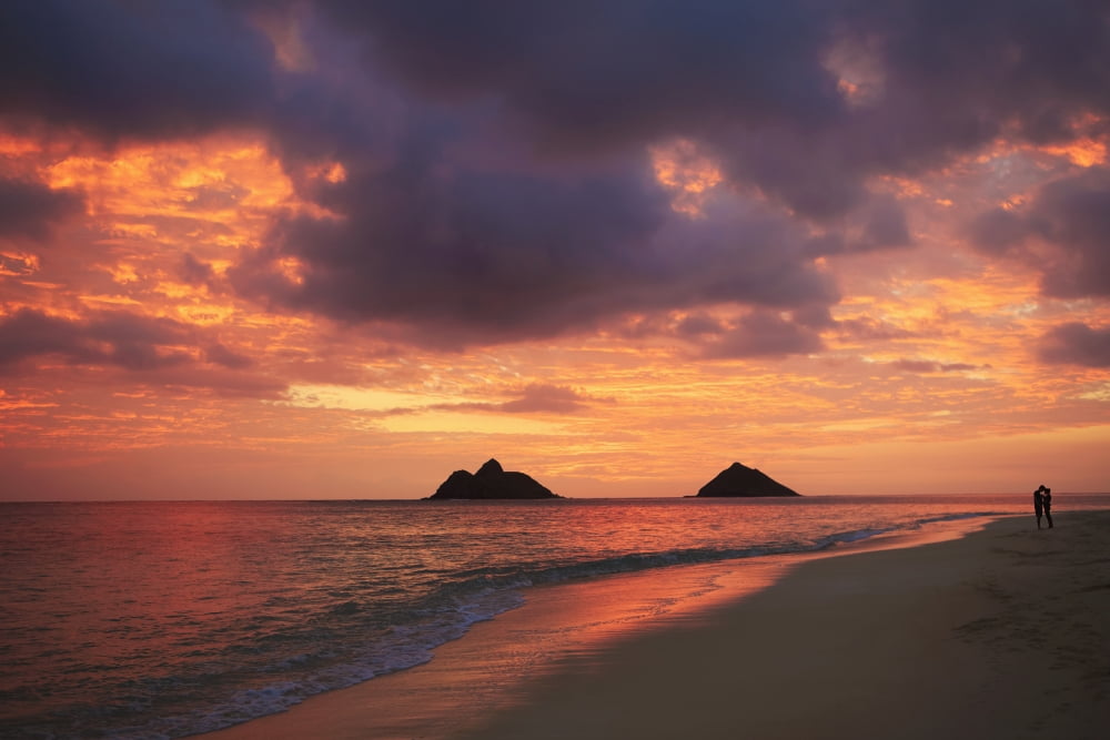 Hawaii Oahu Kailua Lanikai Vibrant sunset with a couple embracing on beach Canvas Art - Tomas del Amo Design Pics (19 x 12)