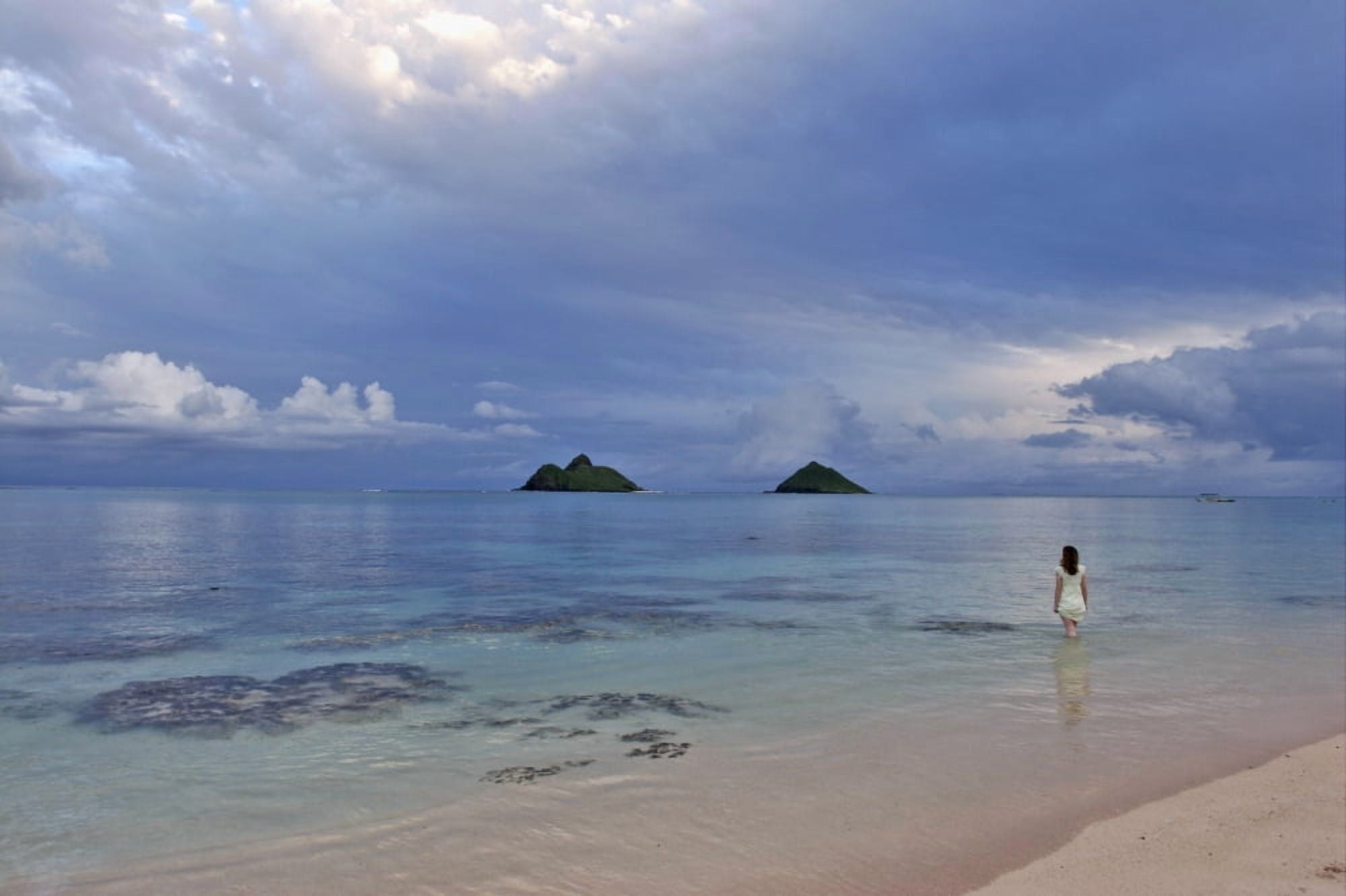 Hawaii Oahu Lanikai A Woman Wades In The Water At The Beach At Dusk Canvas Art - Tomas del Amo Design Pics (18 x 12)