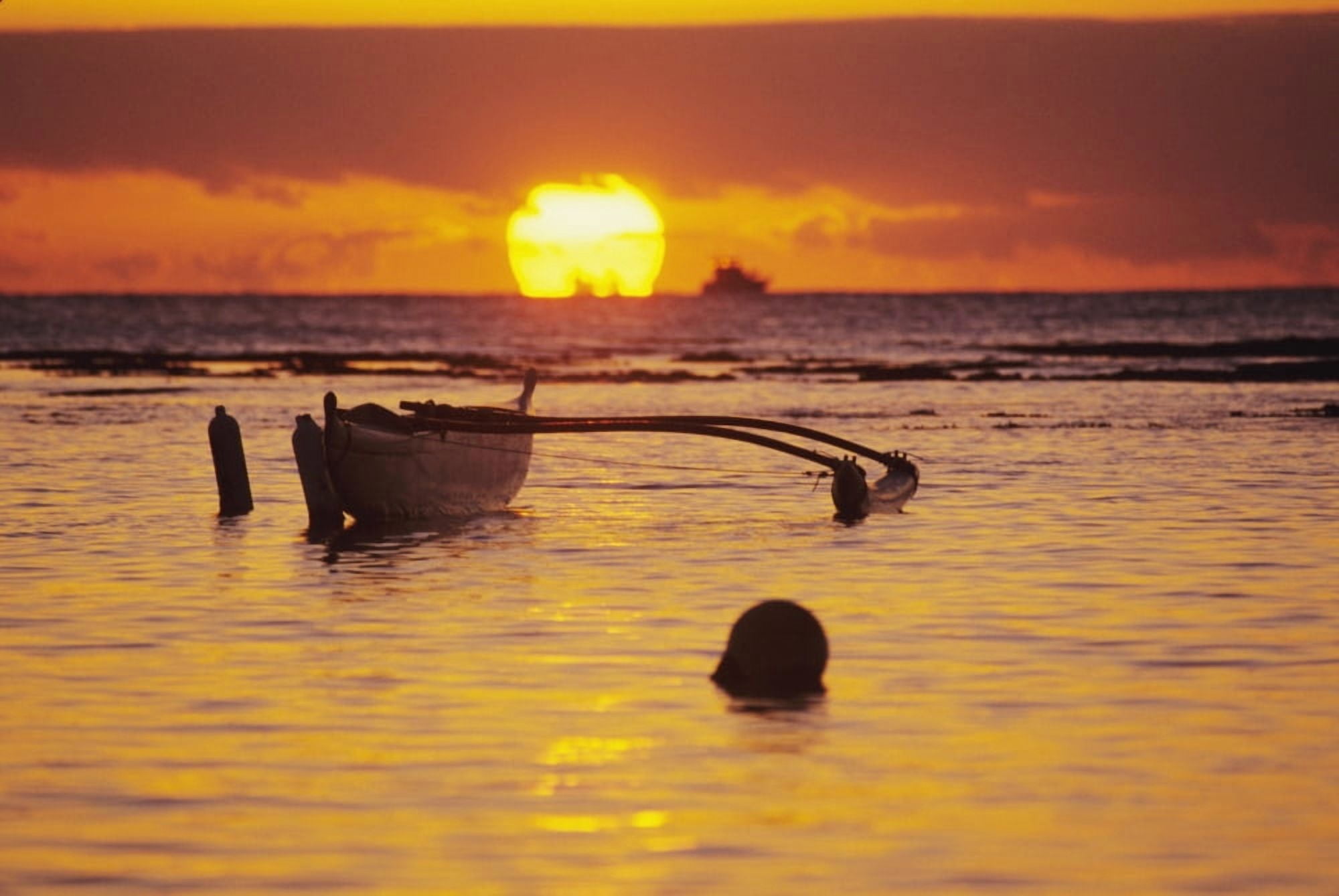 Hawaii Outigger Canoe Silhouetted On Ocean At Sunset Orange Reflections On Water And Sun On Horizon Canvas Art - Joss Descoteaux Design Pics (17 x 11)