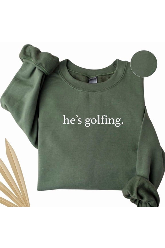 He’s Golfing Sweatshirt – Funny Golfer Wife Crewneck – Golf Season Sweater for Moms – Unisex Fleece Gift for Golf Lovers