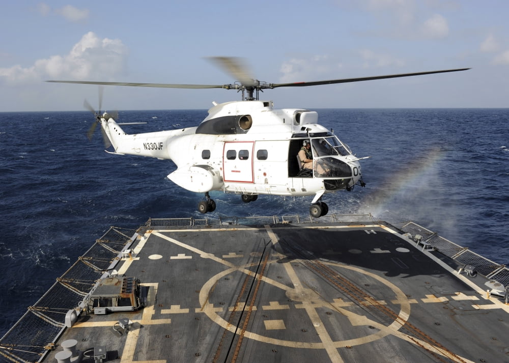 Helicopter lands aboard the Arleigh Burke-class guided-missile destroyer USS Farragut Canvas Art - Stocktrek Images (34 x 24)