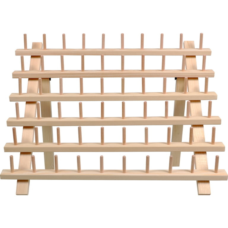 Browse Free HD Images of A Wall With Spools Of Thread On A Wooden Rack