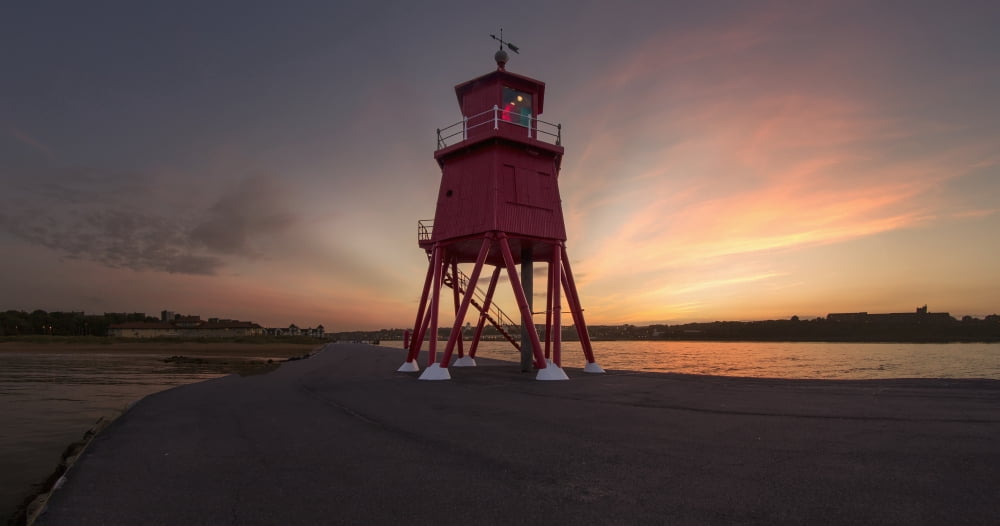 Herd Groyne Lighthouse on the waters edge of the River Tyne at sunset South Shields Tyne and Wear England Canvas Art - John Short Design Pics (42 x 22)