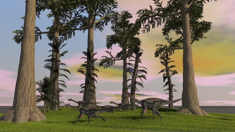Herd of Gigantoraptors running across a grassy field Canvas Art - Kostyantyn IvanyshenStocktrek Images (38 x 22)