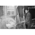 thumbnail image 1 of Hidimi Tayenaka, standing, facing left, pushing a piece of wood through the planer.  Ansel Easton Adams was an American photographer, best, 1 of 1