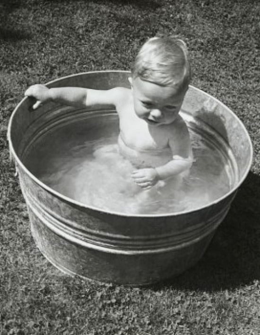 High angle view of a baby boy sitting in a washtub Canvas Art - (18 x 24)