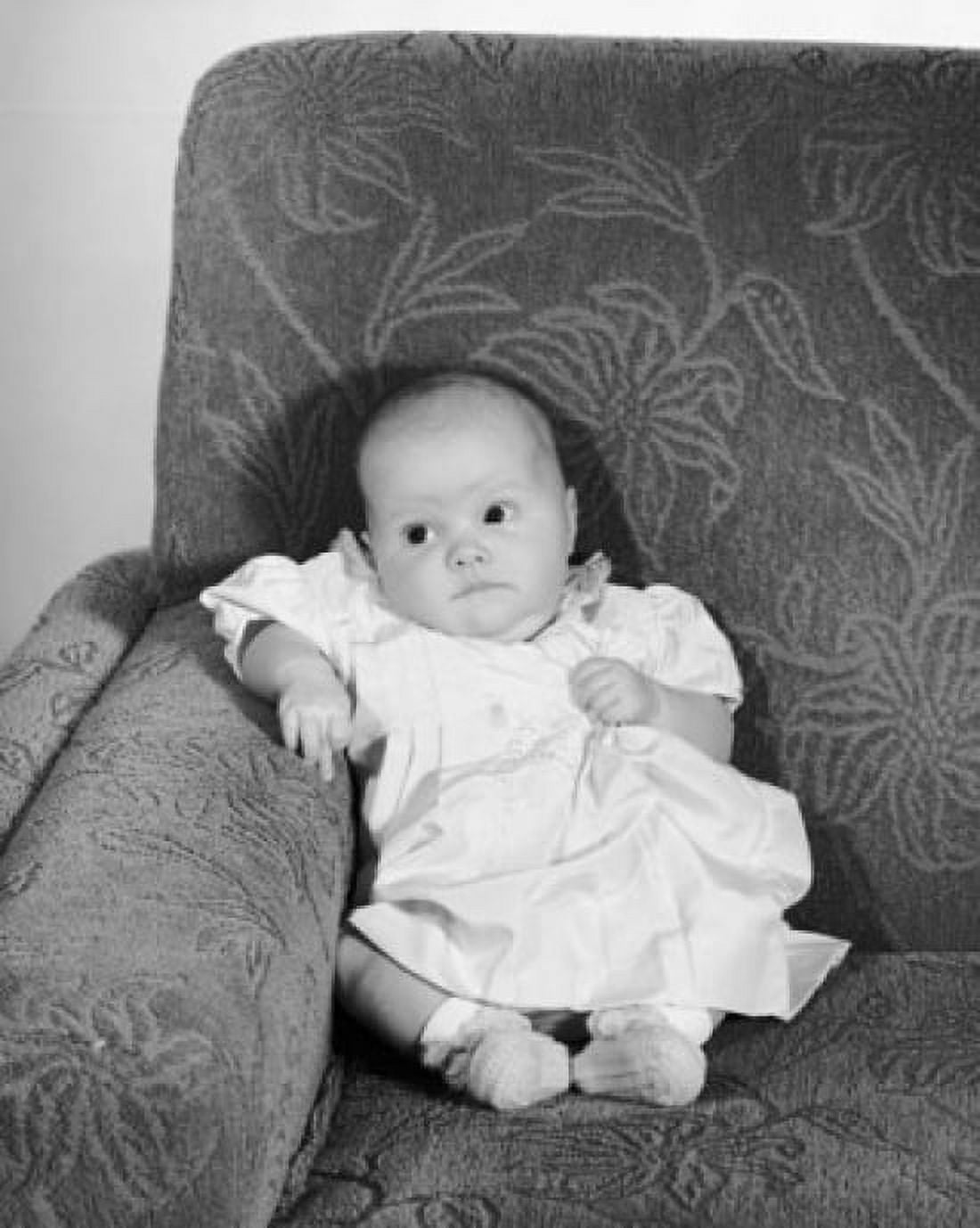 High angle view of a baby girl sitting on a couch Canvas Art - (18 x 24)