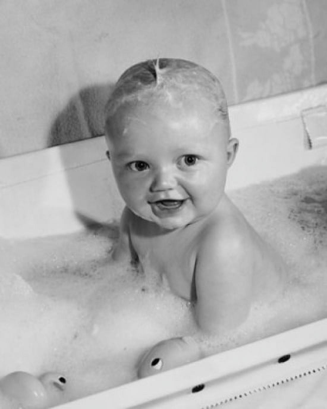 High angle view of a baby smiling in a bathtub Canvas Art - (18 x 24)