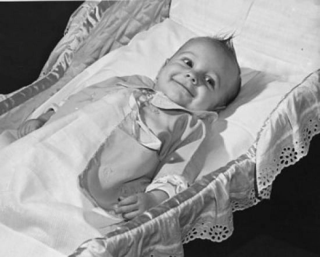 High angle view of a baby smiling in a crib Canvas Art - (18 x 24)