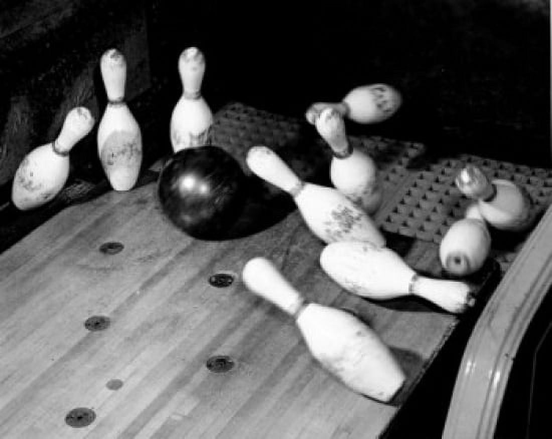 High angle view of a bowling ball knocking down bowling pins Canvas Art - (24 x 36)