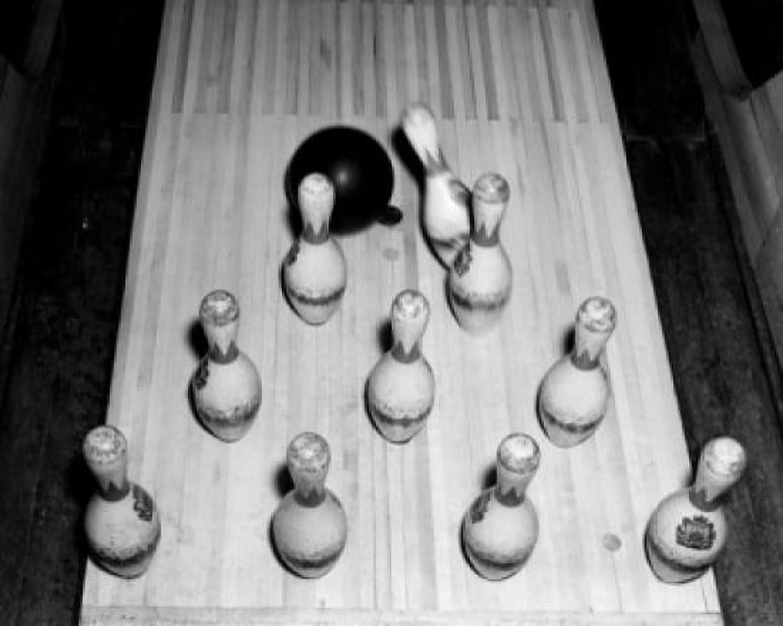 High angle view of a bowling ball knocking down bowling pins Canvas Art - (24 x 36)