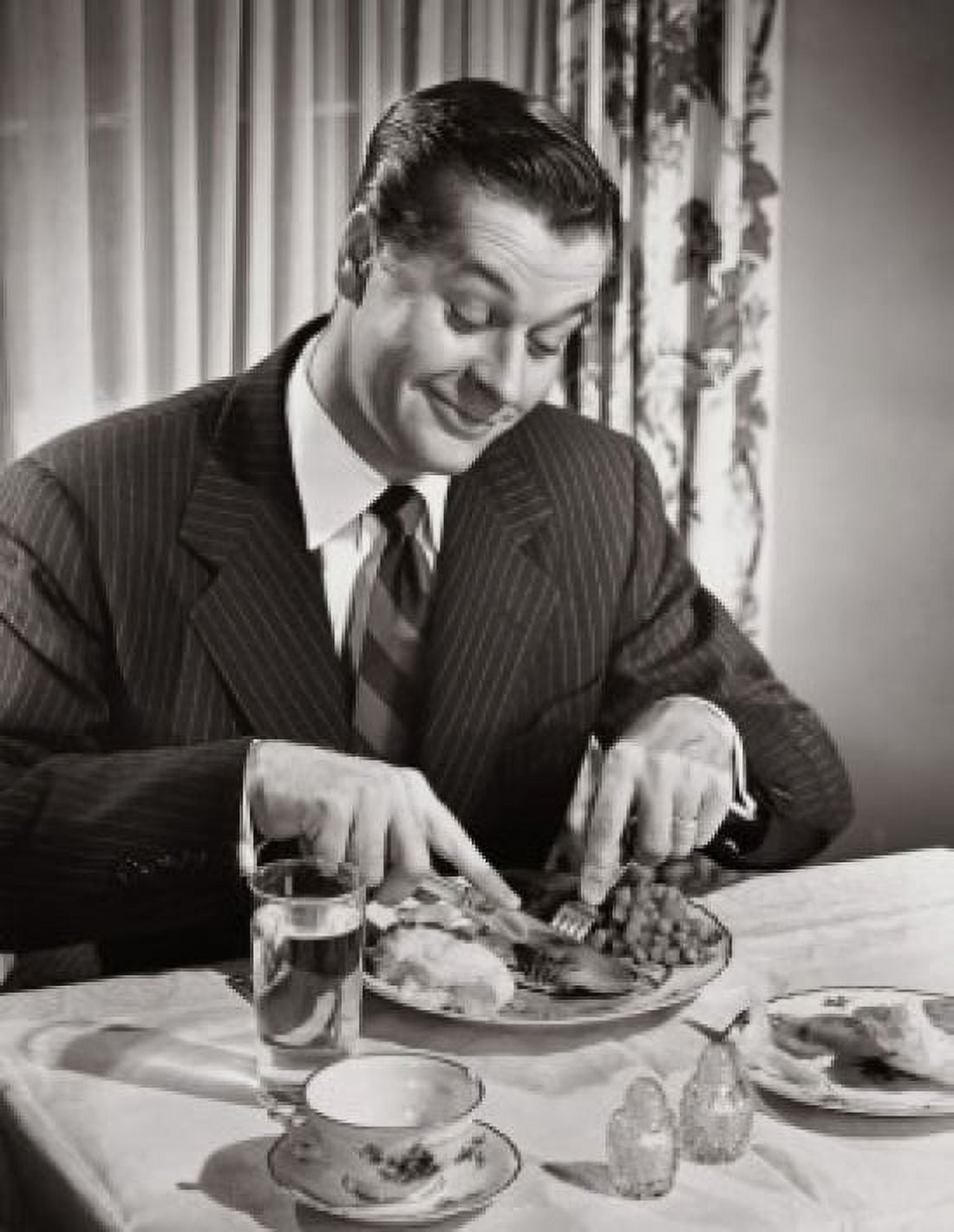High angle view of a businessman eating food Canvas Art - (24 x 36)