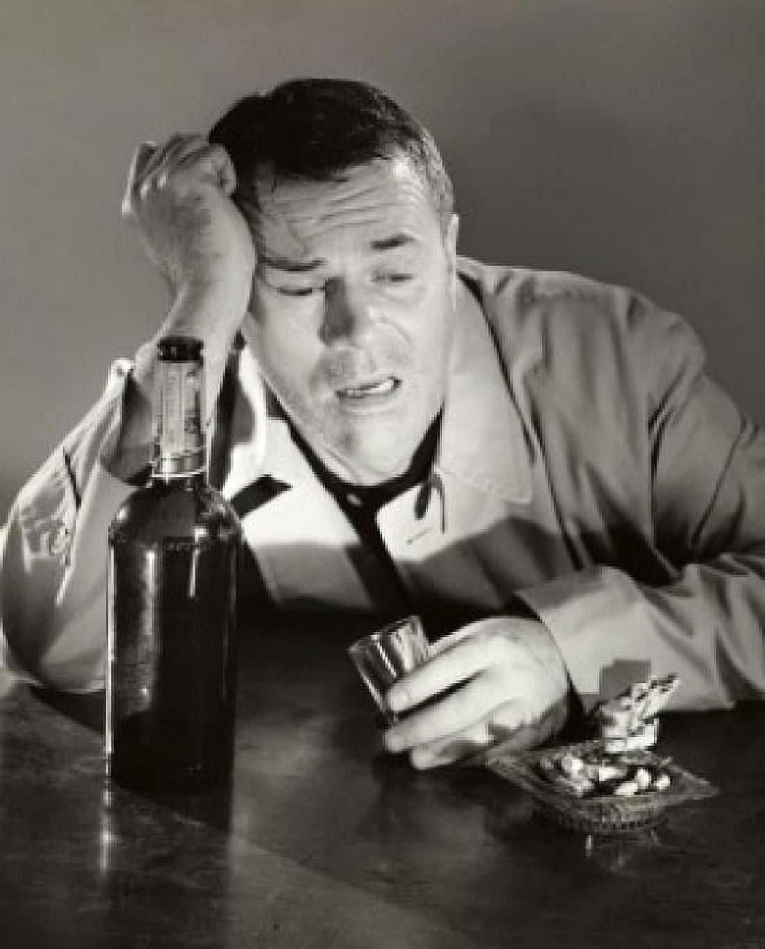 High angle view of a drunk mature man holding a shot glass Canvas Art - (18 x 24)