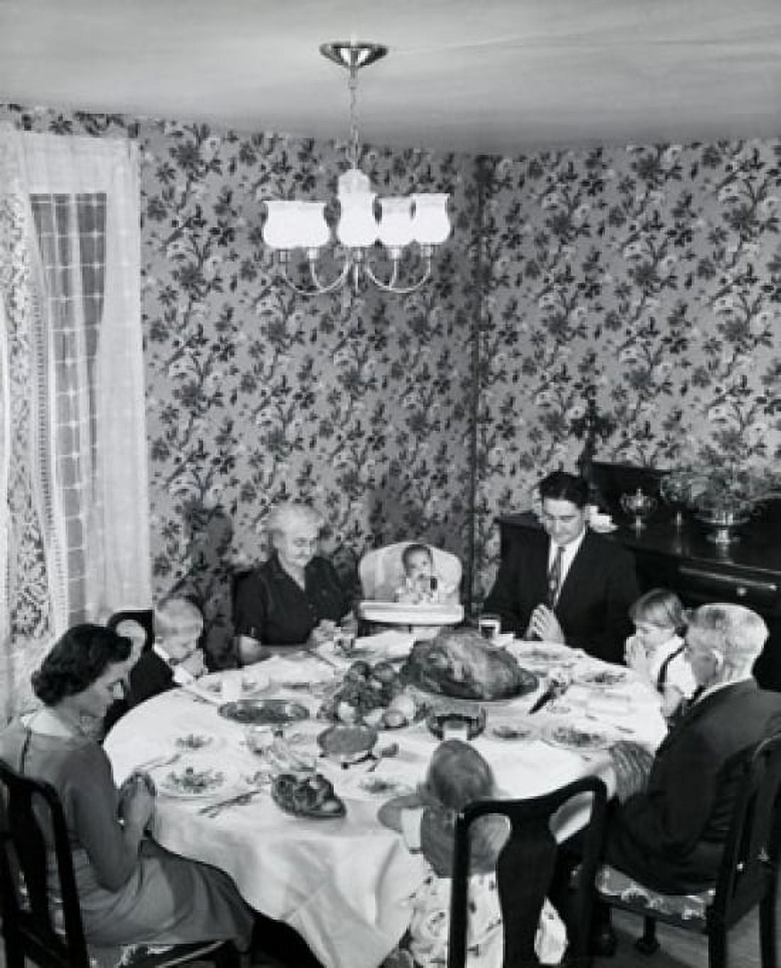 High angle view of a family praying at a dining table on Thanksgiving Day Canvas Art - (24 x 36)